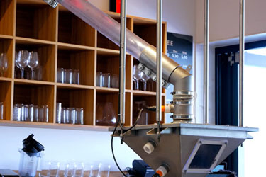 Visible Conveying of Freshly Roasted Beans Creates Unique Customer Experience at Merlo Coffee